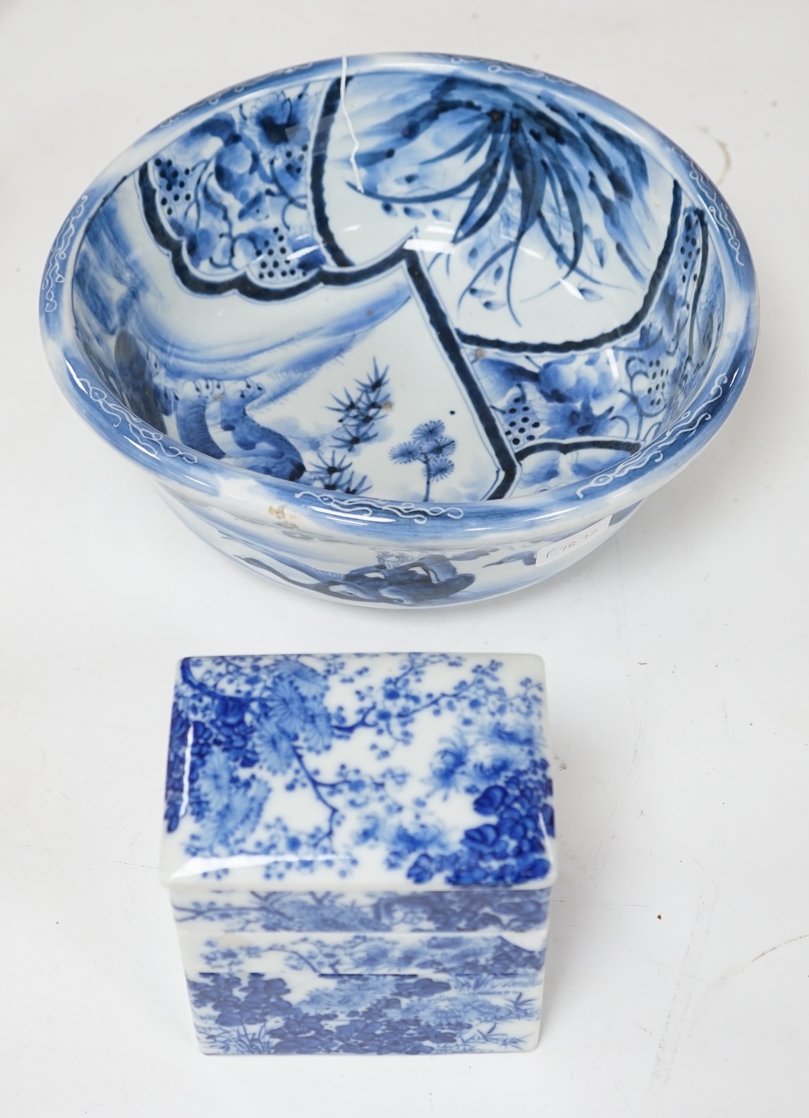 A Japanese blue and white Arita stacking box and bowl, 32cm diameter. Condition - bowl good, box poor